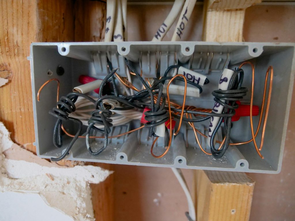 Electrician conducting a switchboard upgrade in Melbourne Office