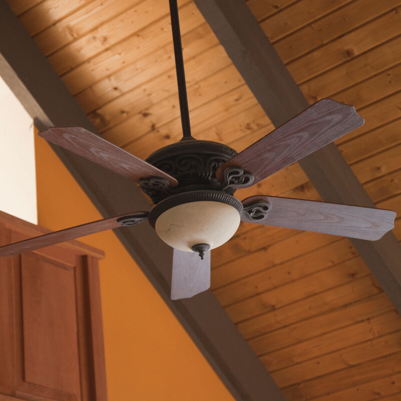 Newly installed ceiling fan with integrated LED lighting in open-plan living area.